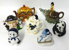 Seven china ornaments including Disney Tea Pot, Jungle book, Wade tea pot, Wade Panda money box,