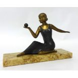 An Art Deco sculpture, a seated lady holding a ball, mounted on a marble plinth, width 24cm.