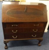 A mahogany writing bureau, with fitted interior and three drawers, on claw/ball fee, t108cm x 91cm