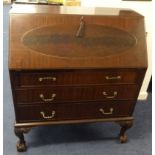 A mahogany writing bureau, with fitted interior and three drawers, on claw/ball fee, t108cm x 91cm