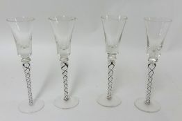 A set of four modern air twist cordial glasses.