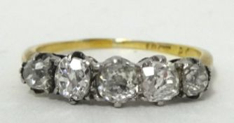 An antique five stone old cut 18ct diamond ring, size L.