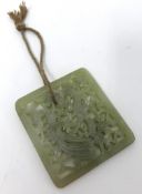 Jade style pierced square pendant decorated with dragon and bird, 6.5cm x 7cm.