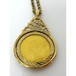 A Victoria half shield back sovereign 1887 set in a yellow metal pendant with chain