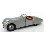 A Franklin Mint Jaguar XK120 model with removable roof scale 1:24.