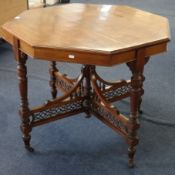 An Edwardian walnut occasional table and a set of four late Victorian dining room chairs