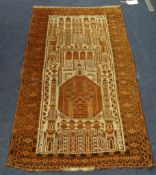 An antique Middle Eastern prayer rug, 140cm x  88cm.