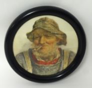 A circular miniature print 'Old Salt'.