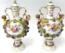 A pair of early 19th century German porcelain vases and covers possibly by Carl Thieme of