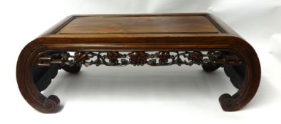 A carved hardwood Chinese coffee table.