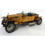 A Franklin Mint 1921 coppered bodied Rolls Royce Silver Ghost with packaging and certificates 1:24