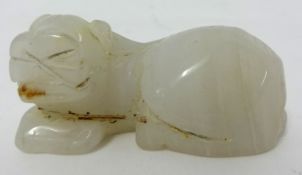 A white jade carving of a water buffalo, 6cm long.