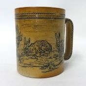 A Doulton Lambeth stoneware tankard by Hannah Barlow, incised with a Rabbits, impressed and monogram