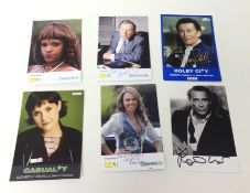A folder of over fifty television related autographs.