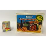 A Mamod steam tractor with power press, boxed.