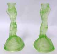 A pair of Art Deco green uranium glass mermaid candlesticks