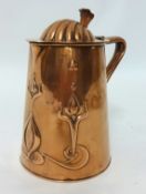 An Art Nouveau copper jug JS & S copper flagon, of tapering cylindrical form repousse with