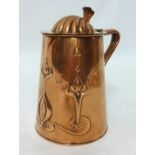 An Art Nouveau copper jug JS & S copper flagon, of tapering cylindrical form repousse with