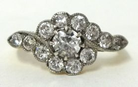 An antique 18ct gold thirteen stone diamond ring. History; purchased in Melbourne Australia in