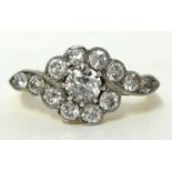 An antique 18ct gold thirteen stone diamond ring. History; purchased in Melbourne Australia in