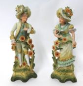 A pair of German bisque figures modelled as a gallant and companion, 36cm high.