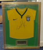 A framed Fernandinho Brazil football shirt, 72cm x 54cm.