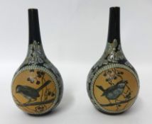 A pair of Doulton Lambeth vases by Florence Barlow, decorated in pate-sur-pate with Finches,