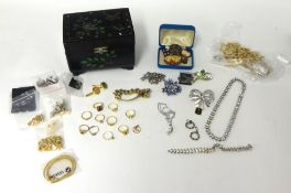 A collection of various costume jewellery including dress rings, bracelet and lacquer jewell box.
