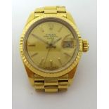 Rolex. A ladies 18ct gold Oyster Perpetual Datejust wristwatch, reference 6900, calibre 2030,