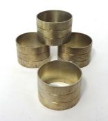 Four circular silver bark finish napkin rings by House of Lawrian, for Christopher N Lawrence,