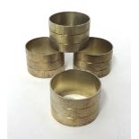 Four circular silver bark finish napkin rings by House of Lawrian, for Christopher N Lawrence,