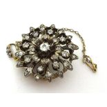 A Victorian diamond set circular Brooch/Pendant, silver set with old and rose cut stones, diamond
