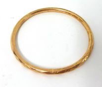A 9ct rose gold facetted slave Bangle, Birmingham 1925, weight 8 grams.