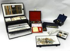 A quantity of costume jewellery together with jewellery boxes.