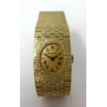 Bueche Girod. A 9ct gold ladies Wristwatch, the oval dial with black Roman numerals, tapering