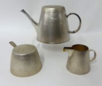 A silver bark finish three piece tea set consisting of teapot complete with matching lid, lidded