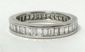A fine ladies diamond set full eternity ring, mounted in platinum, set with 38 baguette cut