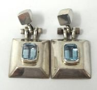 A pair of modern silver contemporary earrings set with coloured stones