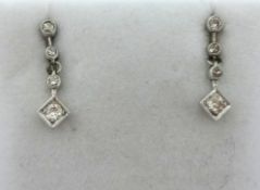 A pair of diamond Earpendants, milligrain set with graduated stones.