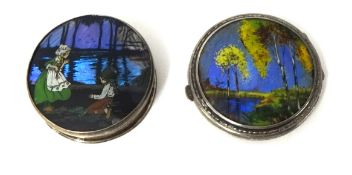 A silver "butterfly wing" circular compact, Birmingham 1928, depicting a woodland scene and a silver