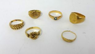 An oval signet Ring, stamped 18C, weight 13 grams, and five 9ct gold rings, weight 15 grams.