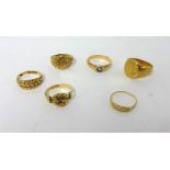 An oval signet Ring, stamped 18C, weight 13 grams, and five 9ct gold rings, weight 15 grams.