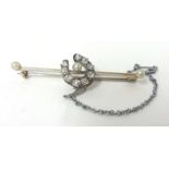 A Victorian pearl and diamond set horseshoe bar Brooch, set with old cut stones, approximately 0.