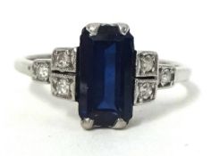 An Art Deco style sapphire and diamond ring set in unhallmarked white metal, size J