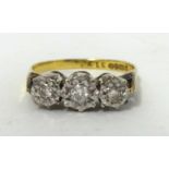 An 18ct gold diamond three stone ring, size N