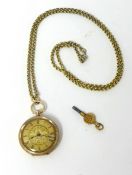 A 14ct gold open face pocket watch, key wind with gilt chain