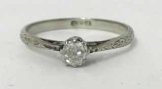 A single stone diamond Ring, claw set with an old cut stone weighing approximately 0.25cts, the