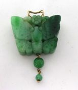 A carved jade butterfly Pendant, with unmarked gold bail, jade untested.