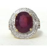 A 14k yellow gold diamond ring set with an oval cut ruby approx 10ct, diamonds approx 1.10total