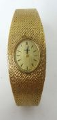 Omega. A Ladies 9ct gold wrist watch with original box and papers circa 1976